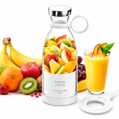 Glass bottle filled with fresh fruit, surrounded by more fruits and a glass of juice on a white background.